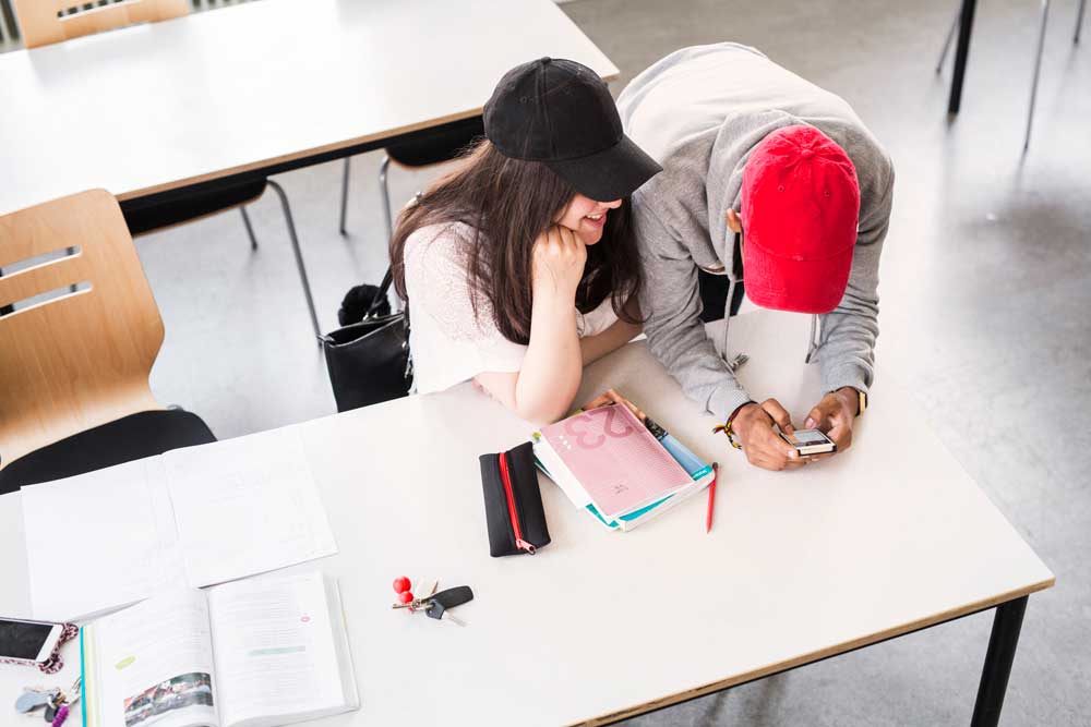 Cheating students in a classroom