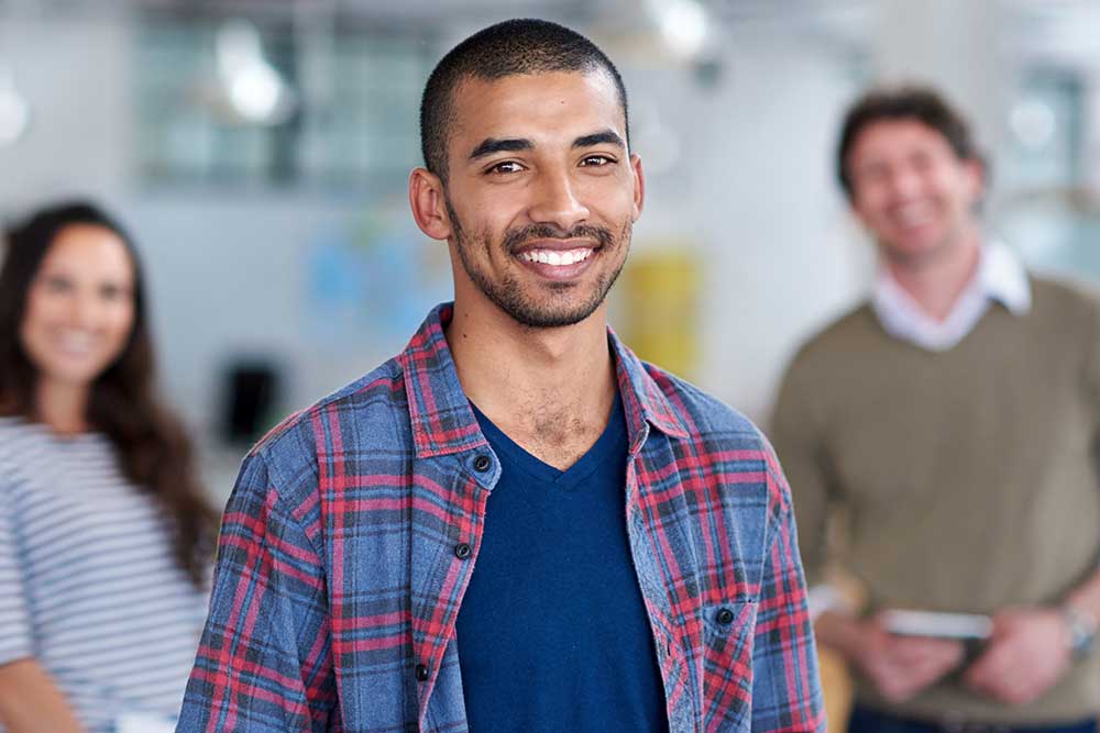 Student in check shirt with peers